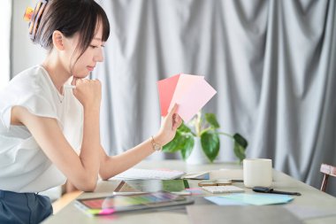 female interior designer thinking about coordination