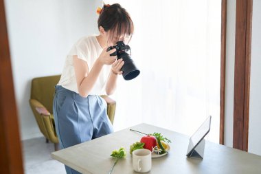 female photographer shooting in the room