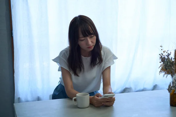 Woman Staring Smartphone Dark Expression — Stok Foto