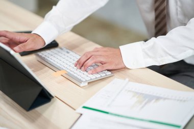 Hands of businessman doing desk work