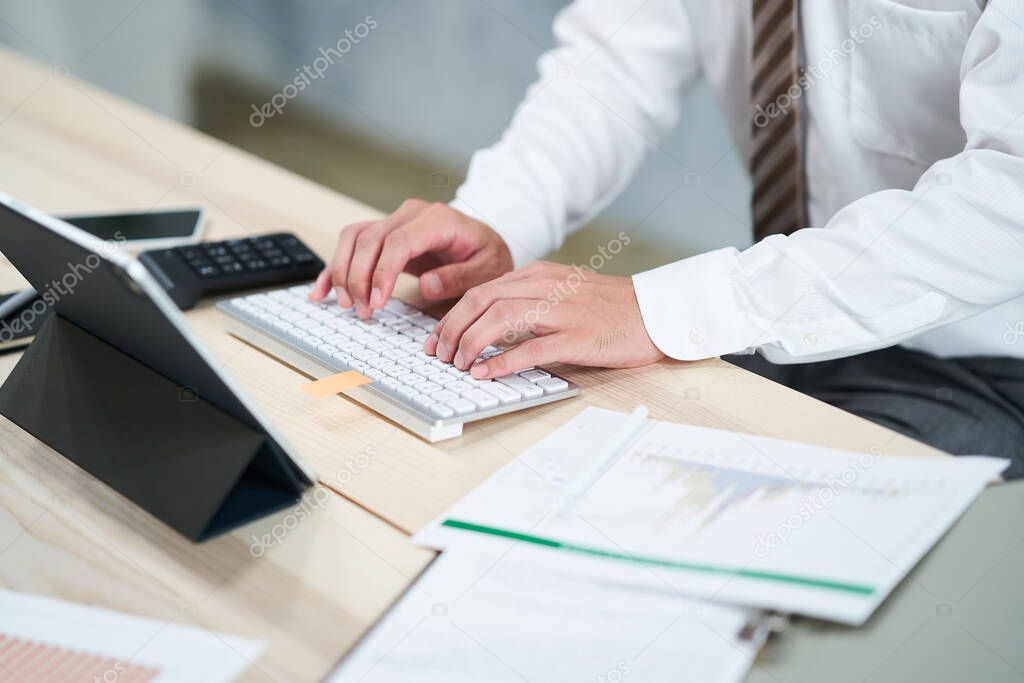 Hands of businessman doing desk work