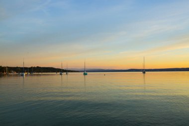 Sailing boats on the Ammersee in the sunset