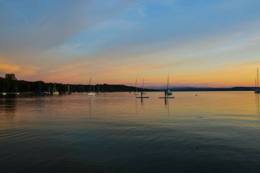 Standup Paddler in the sunset at the Ammersee