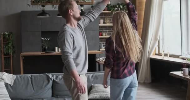 Adorable European couple relaxing dancing turning together holding hands happy marriage weekend — Stock Video