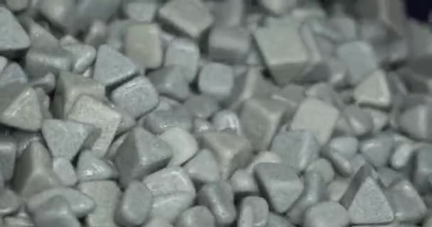 Industrial tumbling. Abrasive stones for vibration grinding metalwork production machinery material — Vídeo de Stock