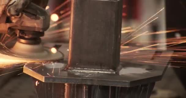 Closeup craftsman hands welding seams with angle grinder working at manufacture fabric — Stockvideo