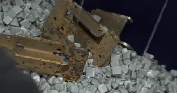 Industrial tumbling. Abrasive stones for vibration grinding metalwork production machinery material — Stockvideo