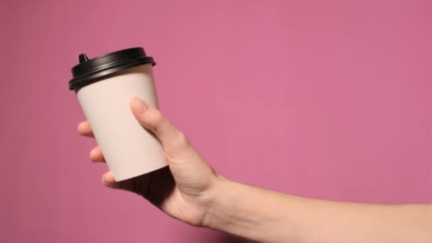 White paper cup with black lid. — Stock Video