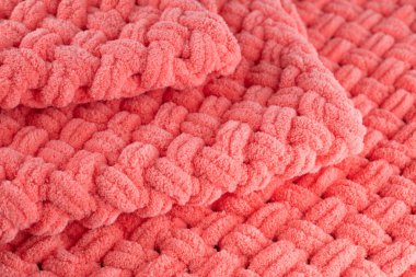 Pembe örülmüş kumaş arkaplanının bulanık görüntüsü. Terasotta desenli pembe arka plan..