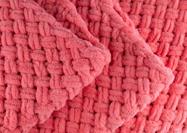 Pembe örülmüş kumaş arkaplanının bulanık görüntüsü. Terasotta desenli pembe arka plan..