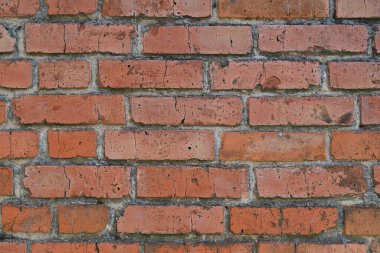 Eski kırmızı tuğlalı bir duvarın bulanık görüntüsü..