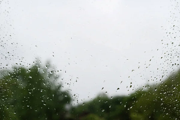 Blurred Image Raindrops Window Background Street Trees Bad Weather Concept — ストック写真