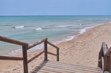 detail of a wooden staircase to the beach
