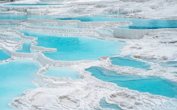 Natural travertine pools and terraces in Pamukkale. Cotton castle in southwestern Turkey.