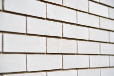 White construction brick wall texture, side view, narrow focus