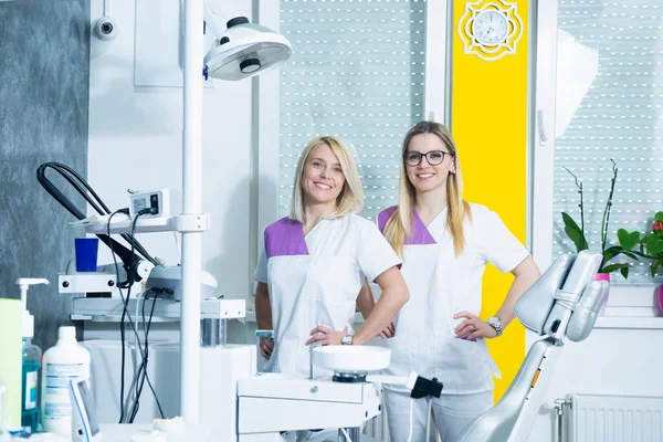 Team Two Female Doctors Smiling Dental Office — Foto de Stock