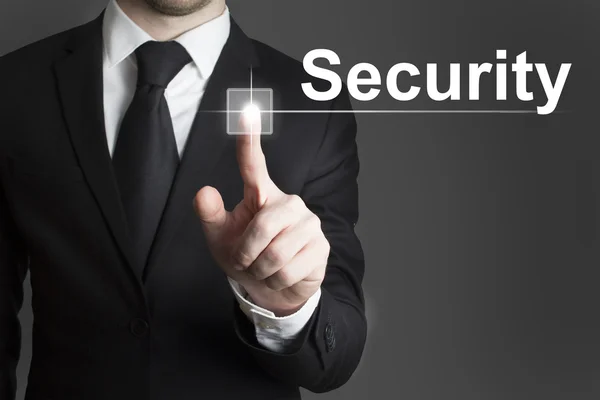 Businessman pressing virtual button security — Stock Photo, Image