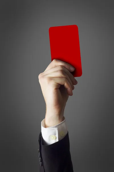 Businessman showing red card — Stock Photo, Image