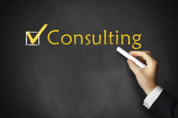 Hand writing consulting on chalkboard — Stock Photo, Image