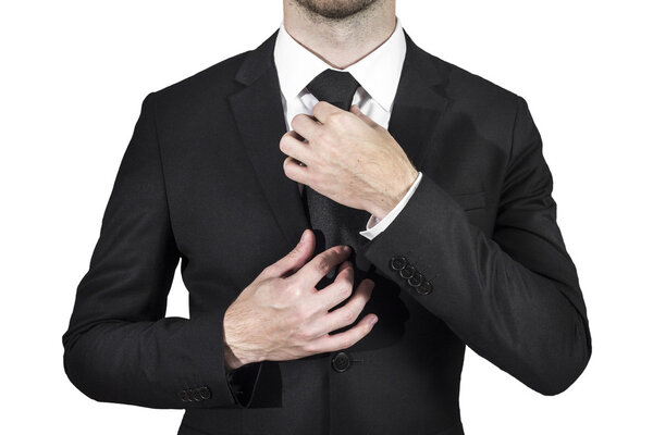 Businessman correcting necktie