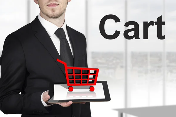 Businessman tablet shopping cart — Stock Photo, Image
