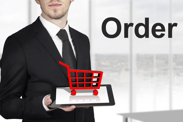 Businessman tablet shopping cart order — Stock Photo, Image