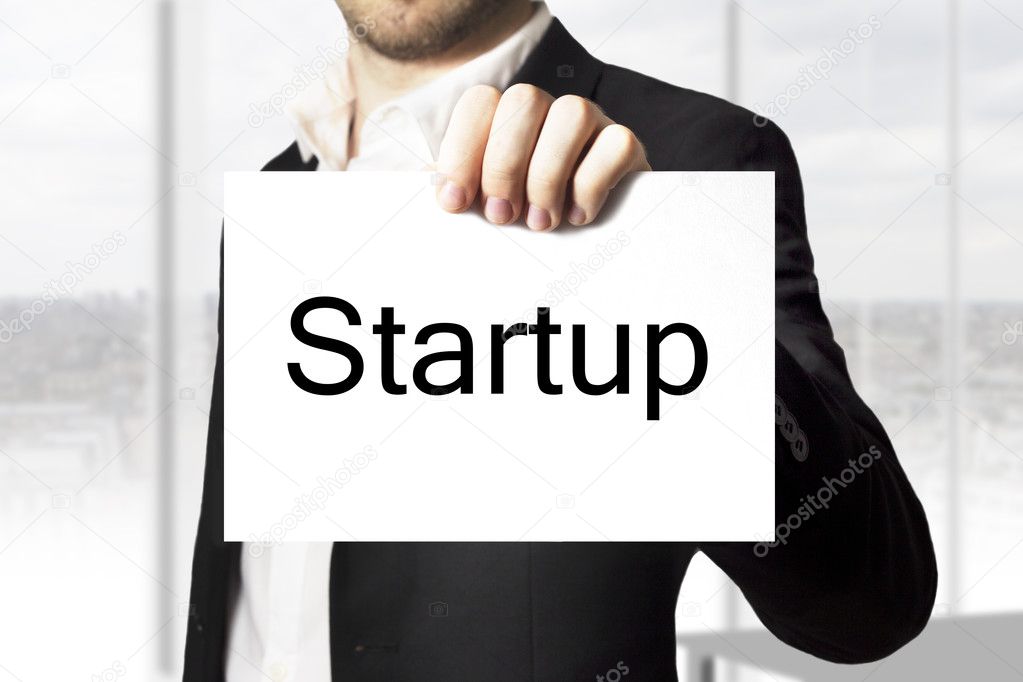 businessman holding sign startup