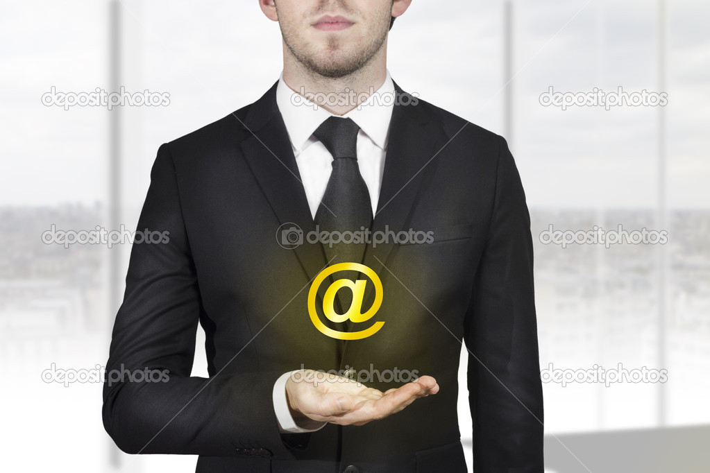 businessman holding web at symbol in hand