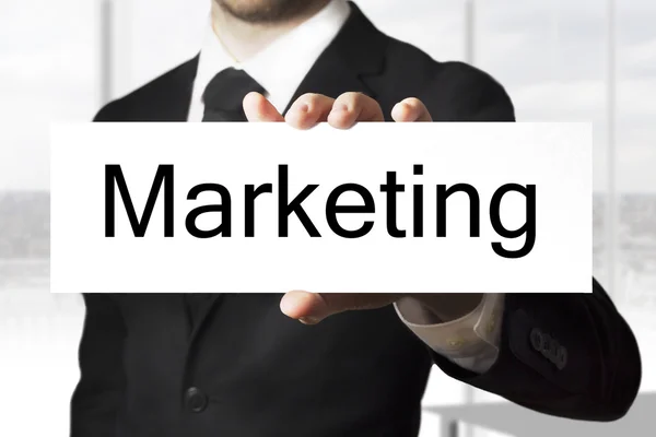 Businessman holding sign marketing — Stock Photo, Image