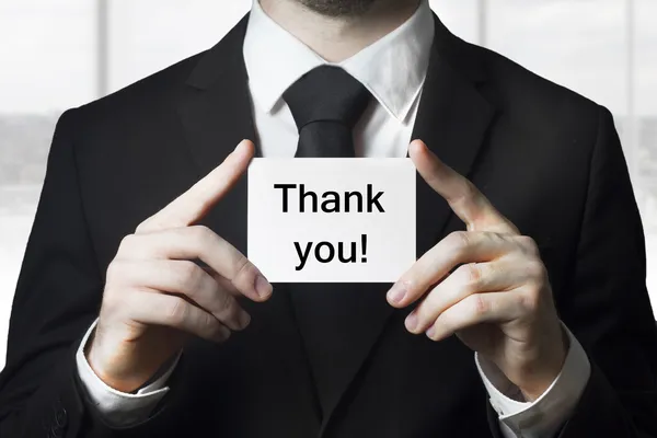 Business man holding card thank you — стоковое фото