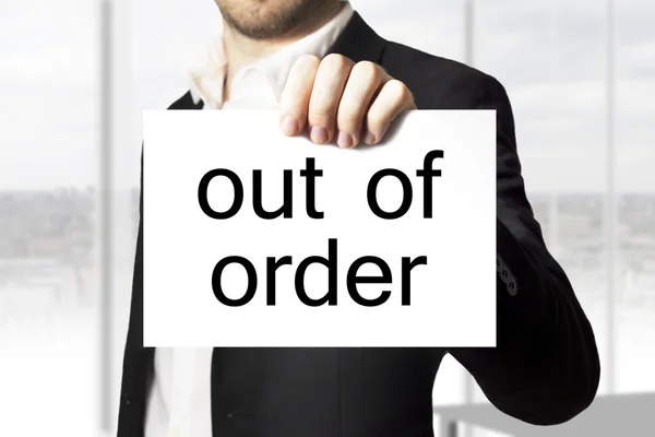 Empresário segurando sinal fora de ordem burnout — Fotografia de Stock