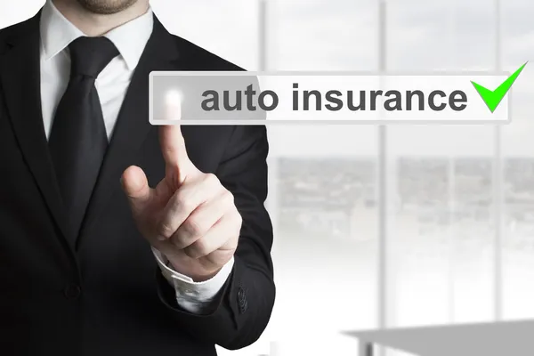 Businessman pushing touchscreen button auto insurance — Stock Photo, Image