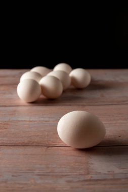 Fresh free range eggs from chicken farm on a wooden table background
