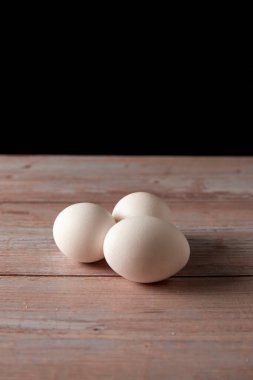 Fresh free range eggs from chicken farm on a wooden table background