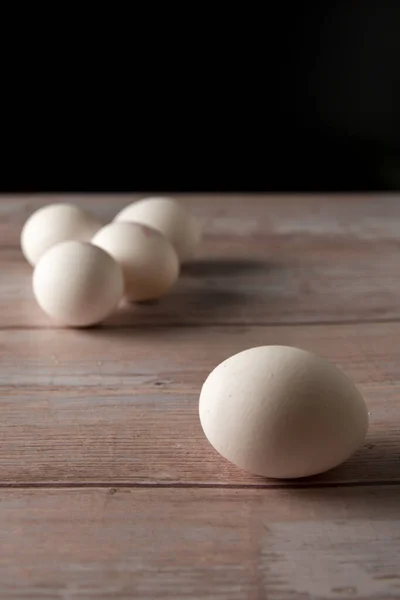 Fresh free range eggs from chicken farm on a wooden table background