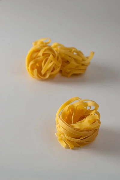 Tagliatelle Italian Pasta Scattered Freely White Background — ストック写真