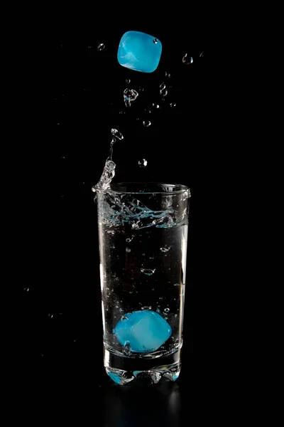 Colour Ice Cubes Thrown Glass Water Splash Black Background —  Fotos de Stock