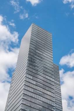 Cologne tower skyscraper at Mediapark during sunny weather with blue sky and clouds