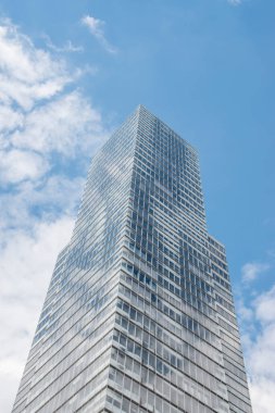 Cologne tower skyscraper at Mediapark during sunny weather with blue sky and clouds