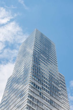 Cologne tower skyscraper at Mediapark during sunny weather with blue sky and clouds