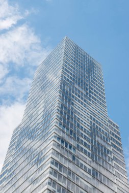 Cologne tower skyscraper at Mediapark during sunny weather with blue sky and clouds