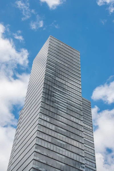 Cologne tower skyscraper at Mediapark during sunny weather with blue sky and clouds