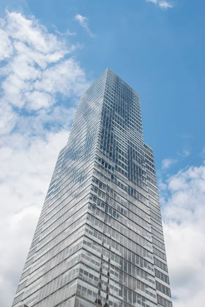 Cologne tower skyscraper at Mediapark during sunny weather with blue sky and clouds