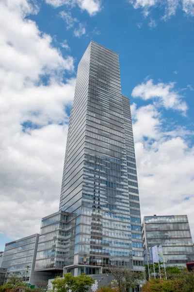 Cologne tower skyscraper at Mediapark during sunny weather with blue sky and clouds