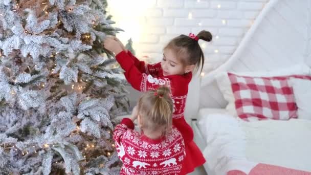 Cute Little Girls Decorate Christmas Tree Home Glass Toys Shape — Stock Video