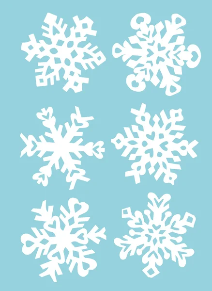 Copos de nieve papel de mano corte — Vector de stock