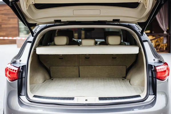 Luxury car boot with folded seats. Opened empty car trunk. Clean trunk of the SUV.