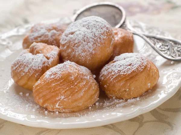 Profiteroles with cream — Stock Photo, Image