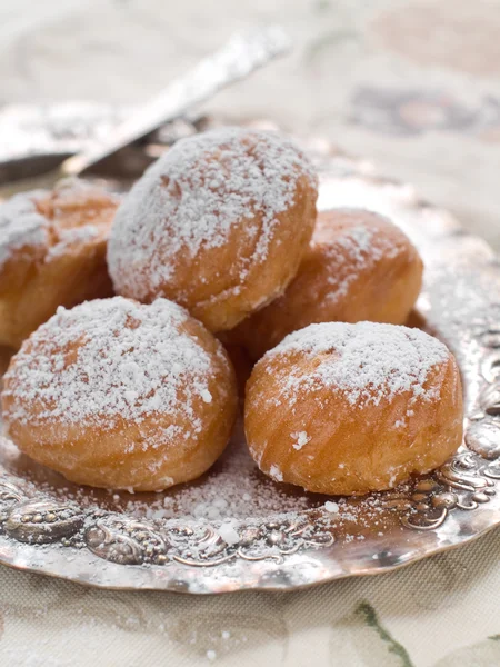 Profiteroles with cream — Stock Photo, Image