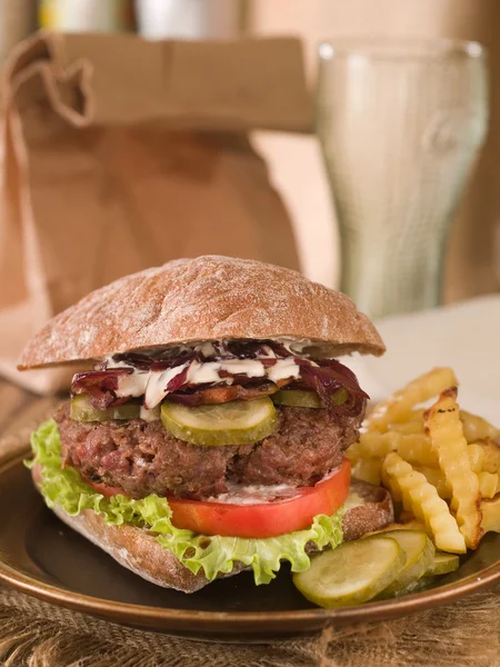 Hamburger with cucumber and onion — Stock Photo, Image